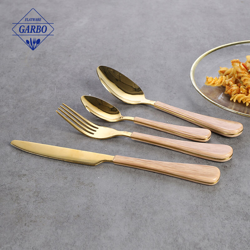 Gold 410 flatware sets china factory with wooden design plastic handle 