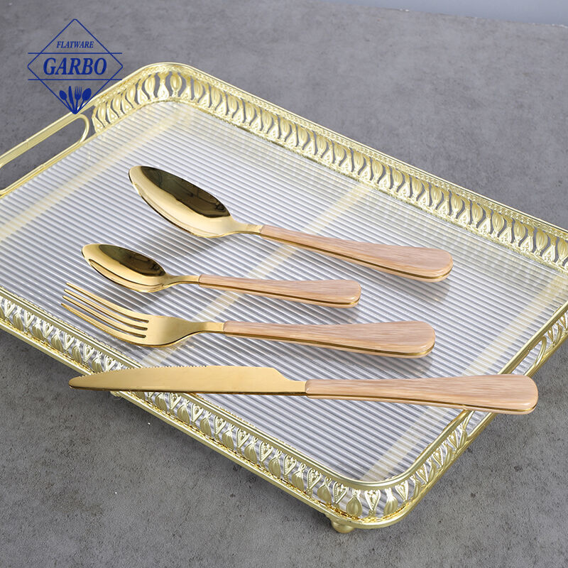 Gold 410 flatware sets china factory with wooden design plastic handle 