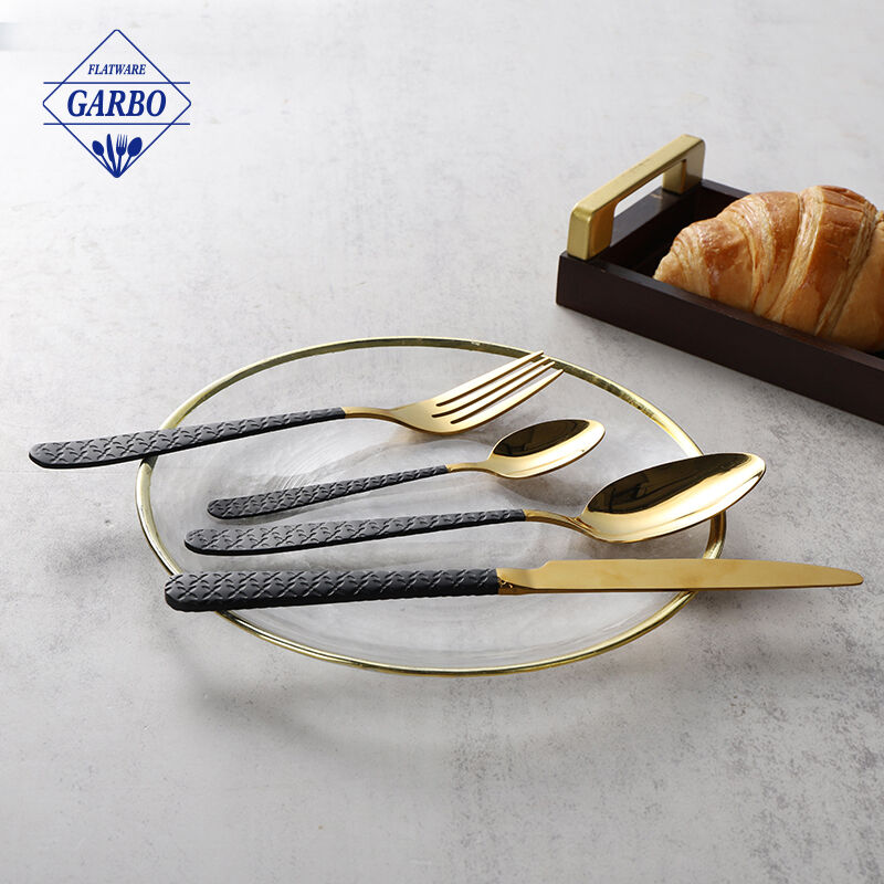 Luxury golden stainless steel cutlery set with embossed and black color handle