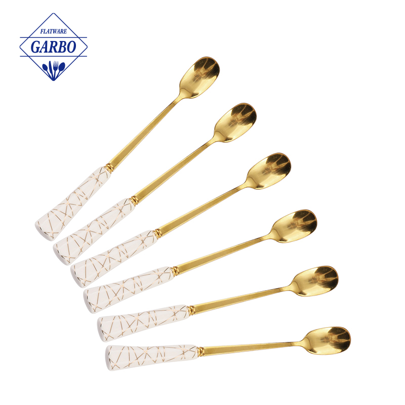 ceramic handel with golden design stainless steel tea spoon