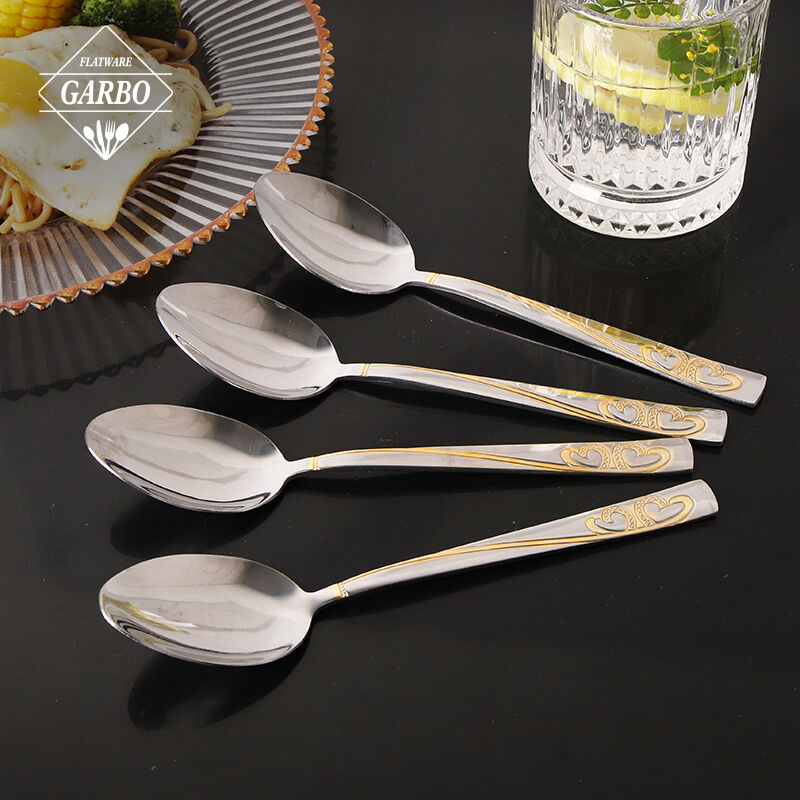 Stainless steel 18/2 spoon with heart shape design and golden plating