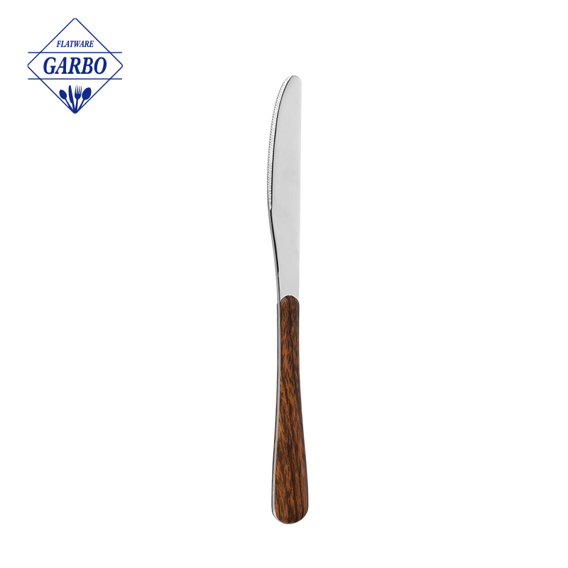 エレガントでシンプルなステンレススチールのディナーナイフ、ABSプラスチックハンドル付き、木製プリントデザインが特徴です。