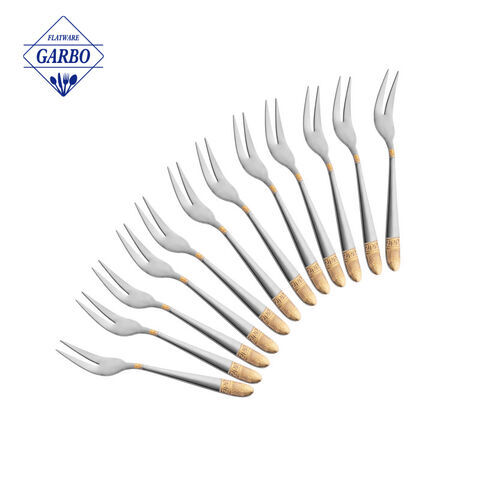 China factory wholesale cheap 410 stainless steel dinner fork with gold color and ceramic handle