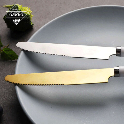 Set di coltelli da bistecca in acciaio inossidabile argento e oro con manico bianco