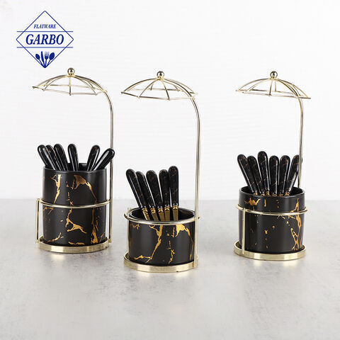 Cuillère en acier inoxydable avec poignée en céramique marbrée et support en céramique conçu pour un parapluie créatif