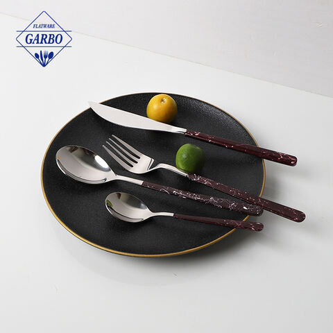 Stainless steel flatware set with spray marble design handle