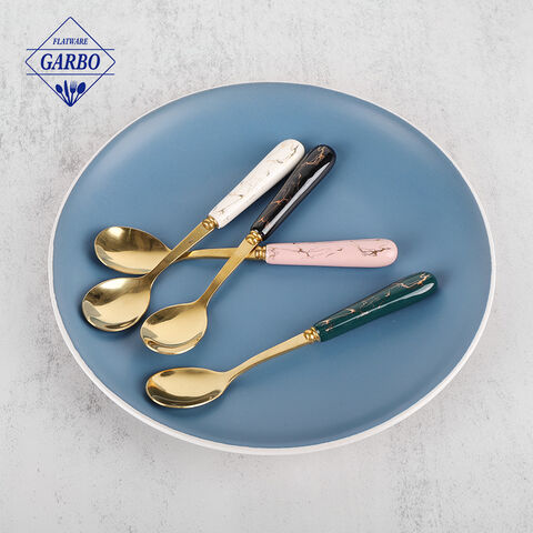 Colored stainless steel flatware with marble design ceramic handle spoon.