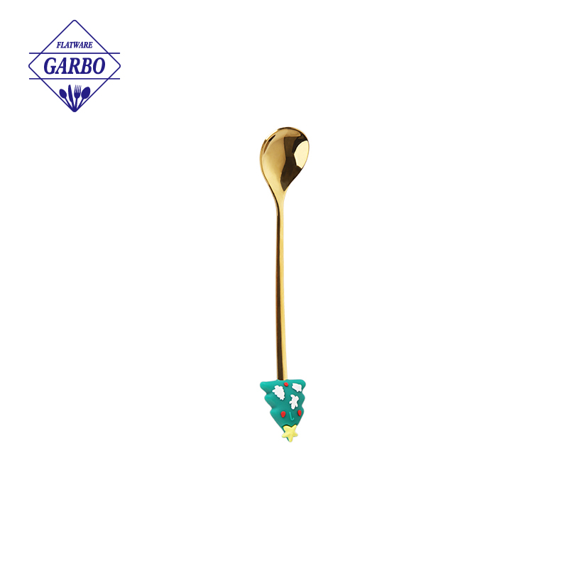 Gold color stainless steel tea fork with flower design
