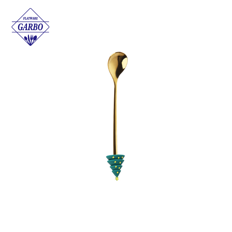 Gold color stainless steel tea fork with flower design